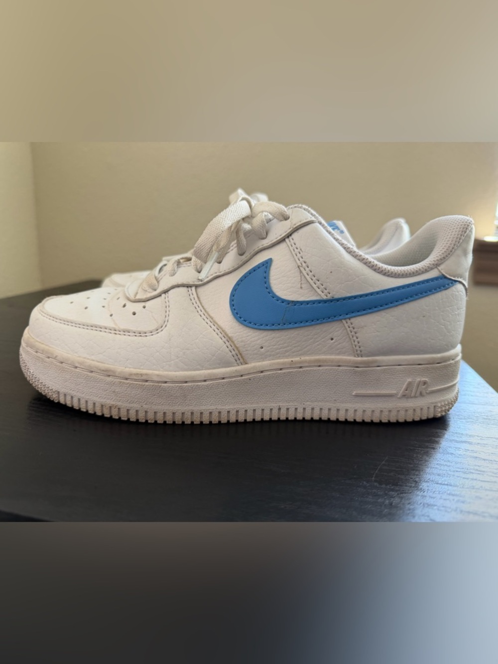 Nike White Low-Top Sneaker with Sky Blue Swoosh